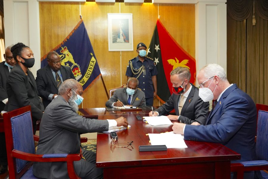 Image Caption: (From Left to Right) Petroleum Minister, Hon. Kerenga Kua; Governor General, Grand Chief Sir Bob Dadae; Chairman of Esso PNG P’nyang Limited, Peter Larden; and SANTOS Chief Operating Officer – Upstream Oil & Gas, Brett Darley, signing the P’nyang Gas Agreement at Government House. PHOTO: ExxonMobil PNG