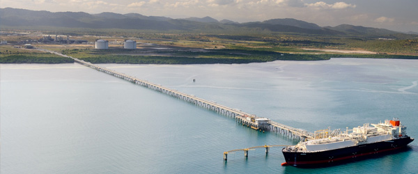 An LNG carrier berthed at the end of a long jetty