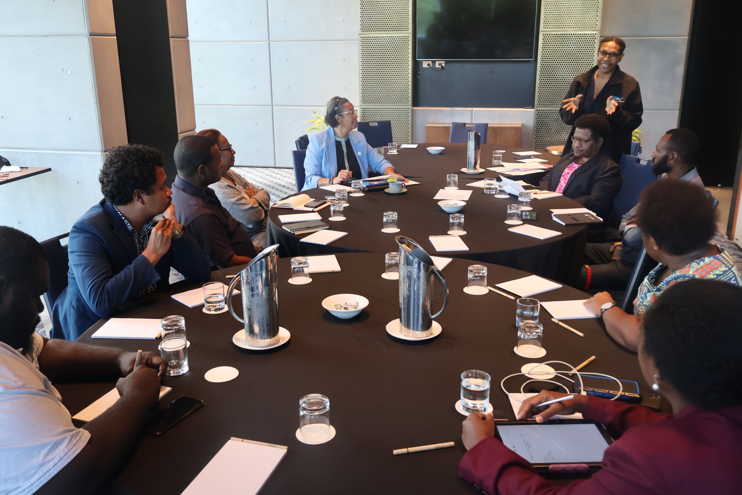 PNGCORE's Acting Communications and Public Relations Manager speaking to journalists at a media briefing, May 2025