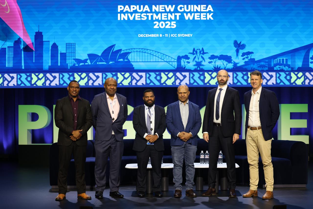 Six delegates on stage at Papua New Guinea Investment Week 2025.
